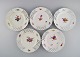 Five antique Meissen plates in openwork porcelain with hand-painted flowers. 
Marcolini period 1774-1814.
