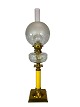 Kerosene lamp of brass with white opaline glass shade and yellow glass stem, 
from around the 1860s. 
5000m2 showroom.
Great condition
