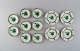 Herend Green Chinese Bouquet. Eight small bowls and four plates in hand-painted 
porcelain. Mid-20th century.
