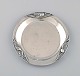 Georg Jensen Blossom bottle tray in hammered sterling silver. Model 2A. Dated 
1915-1930.

