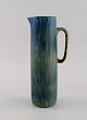 Carl Harry Stålhane (1920-1990) for Rörstrand. Jug in glazed ceramics. Beautiful 
glaze in shades of blue-green. Mid-20th century.

