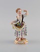 Antique Meissen figure in hand-painted porcelain. Girl picking flowers. 19th 
century.

