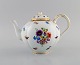 Antique Meissen porcelain teapot with hand-painted gold decoration, flowers and 
insects. 19th century.
