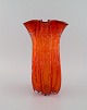 Large Murano vase in mouth blown art glass. Wavy edge and inlaid bubbles. 
Italian design, 1960s / 70s.
