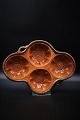 Rustic Swedish 1800s clay mold with 4 compartments with a pattern at the bottom.
Fine as a snack bowl for nuts, olives, etc. 
H:5cm. 30x22cm.