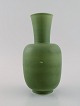 Wilhelm Kåge for Gustavsberg. Vase in glazed ceramics. Beautiful glaze in olive 
green shades. Mid-20th century.
