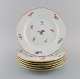 Six antique Meissen porcelain plates with hand-painted flowers and gold edge. 
Early 20th century.
