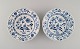 Two Meissen Blue Onion deep plates in hand-painted porcelain. Early 20th 
century.
