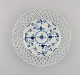 Antique Royal Copenhagen Blue Fluted plate in openwork porcelain. 1820s.
