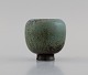 Gunnar Nylund (1904-1997) for Rörstrand. Miniature vase in glazed ceramics. 
Beautiful glaze in blue-gray and earth shades. Mid-20th century.

