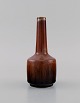 Carl Harry Stålhane (1920-1990) for Rörstrand. Narrow neck vase in glazed 
ceramics. Beautiful metallic glaze in reddish brown shades. Mid-20th century.
