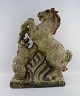 Knud Kyhn (1880-1969) for Royal Copenhagen. Large and rare sculpture in glazed 
stoneware. Horse and bear. Model number 21418. Limited edition 2/5. Dated 1957.
