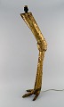 Large zoomorphic floor lamp in welded brass shaped like an animal leg. French 
design, mid 20th century.
