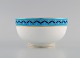 Mintons, England. Bowl in hand-painted porcelain. Blue border with flowers and 
gold decoration. Early 20th century.
