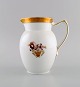 Royal Copenhagen Golden basket jug in porcelain with flowers and gold 
decoration. Model number 595/9087. Early 20th century.

