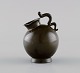 Just Andersen (1884-1943), Danmark. Tidlig miniature vase i diskometal. Hank 
formet som slange. 1930