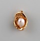 Scandinavian jeweler. Organically shaped pendant in 14 carat gold adorned with 
cultured pearl.

