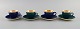 Four Royal Copenhagen / Aluminia Confetti mocha cups with saucers in glazed 
faience with interior gold. Mid-20th century.
