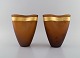 Salviati, Murano. To vaser i ravfarvet mundblæst kunstglas med guld bånd. 
Italiensk design. Tidligt 21. århundrede.
