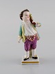 Augustus Rex, Germany. Antique hand-painted porcelain figure. Boy with sack. 
19th century.
