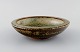 Kresten Bloch for Royal Copenhagen. Bowl in glazed ceramics. Beautiful sung 
glaze. Mid-20th century.
