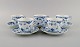 Five Royal Copenhagen Blue Fluted Half Lace coffee cups with saucers. Model 
number 1/756.

