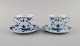 Two Royal Copenhagen Blue Fluted Full Lace coffee cups with saucers. Model 
number 1/1035.
