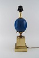 Le Dauphin, France. Table lamp with blue orb and brass base with leaves. 1960 / 
70s.
