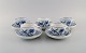 Five Meissen Blue Onion coffee cups with saucers in hand-painted porcelain. 
Early 20th century.
