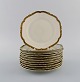 KPM, Berlin. 11 Royal Ivory cake plates in cream-colored porcelain with gold 
decoration. 1920s.
