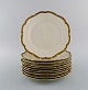 KPM, Berlin. 10 Royal Ivory dinner plates in cream-colored porcelain with gold 
decoration. 1920s.
