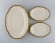 KPM, Berlin. Three Royal Ivory serving dishes in cream-colored porcelain with 
gold decoration. 1920s.
