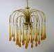 Large and impressive Murano chandelier / ceiling lamp. Brass frame with long 
drops in amber colored mouth-blown art glass. Italian design, 1960s / 70s.
