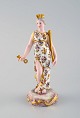 Meissen, Tyskland. Sjælden håndmalet porcelænsfigur. Dronning med krone, nøgle 
og scepter. Sent 1800-tallet.
