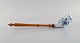 Presumably Meissen Blue Onion soup ladle in hand-painted porcelain with handle 
in turned wood. Approx. 1900.
