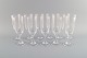 11 René Lalique Chenonceaux champagne flutes in clear mouth-blown crystal glass. 
Mid-20th century.
