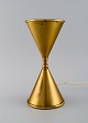 Hourglass shaped designer table lamp in brass. Mid-20th century.
