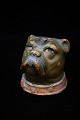 K&Co. presents: Old ceramic piggy bank in the form of dogs head with old paint and fine patina. H:8,5cm. 8x8cm.