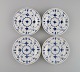 Four Royal Copenhagen Blue Fluted Plain side plates in hand-painted porcelain. 
Model number 1/182. Early 20th century.
