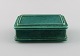 Wilhelm Kåge (1889-1960) for Gustavsberg. Argenta art deco lidded box in glazed 
ceramics. Beautiful glaze in shades of green. Mid-20th century.
