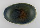 Carl Harry Stålhane (1920-1990) for Rörstrand. Organically shaped bowl in glazed 
ceramics. Beautiful glaze in shades of blue-green. Mid-20th century.
