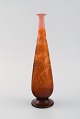 Emile Gallé vase in frosted and orange art glass carved in the form of flowers 
and foliage. Early 20th century.
