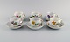 Six Meissen coffee cups with saucers in hand-painted porcelain. Flowers and gold 
decoration. Early 20th century.
