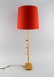 Nicolas de Wael for Fondica. Large table lamp in bronze with original red shade. 
France, 1980s.
