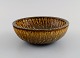 Gunnar Nylund (1904-1997) for Rörstrand. Bowl in glazed ceramics. Beautiful 
birch wood glaze in brown shades. Mid-20th century.
