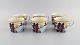 Porcelaine de Paris. "Aurore Tropicale". Seks kaffekopper i porcelæn dekoreret 
med blomster, granatæbler og bambus. 1980