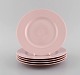 Five Arabia plates in pink glazed porcelain. Mid 20th century.
