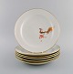 Six rare art deco Meissen dinner plates with hand-painted peacocks and gold 
decoration. 1930s.
