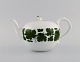 Meissen Green Ivy Vine teapot in hand-painted porcelain. Lid modeled with rose 
bud. 1940