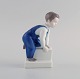 Claire Weiss for Bing & Grøndahl. Porcelain figure. Boy. 1970s. Model number 
2399.
